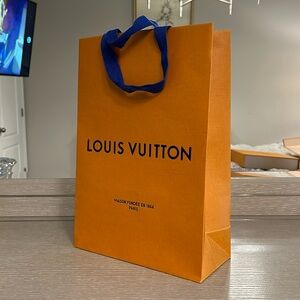 Authentic Louis Vuitton shopping bag. 14 inches tall, 10 inches wide.